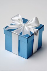 Obraz premium Blue open gift box with white satin bow on a pristine white background