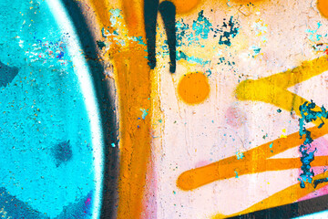 Abstract graffiti wall with turquoise, orange, pink. Urban street art style, vibrant colors, rough texture. Background, texture, pattern, digital art, creative banner.
