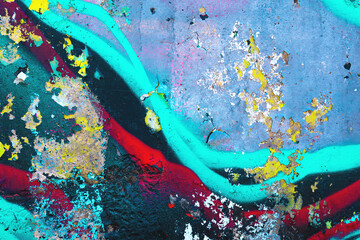 Grunge wall texture - bright turquoise, yellow, red, black colors. Urban street art, abstract, 2000s graffiti style, colorful layers. Background texture, pattern, digital art, creative banner
