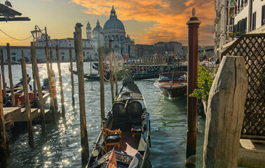 Gondolas moored in the Grand Canal in Venice with the Basilica of Santa Maria della Salute in the background