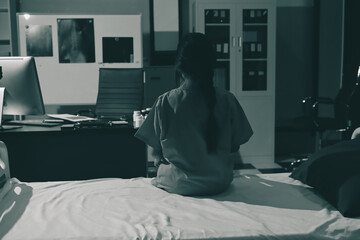 A patient with depression looks outside.