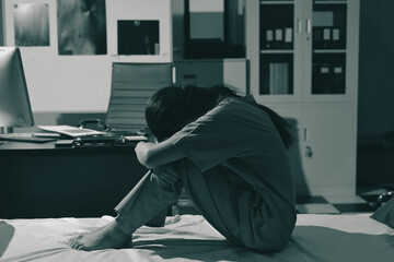 A patient with depression looks outside.