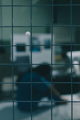 A patient with depression looks outside.