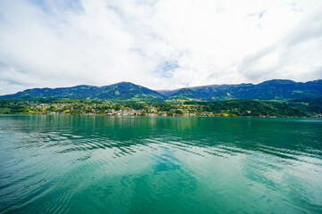 View of Lake Millstatt and the surrounding green landscape. Idyllic nature by the lake north of the Drava Valley near the town of Spittal an der Drau in Carinthia.
