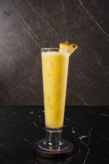 Yellow Smoothie in Tall Glass.