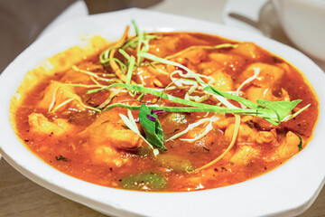A plate of stewed vegetables tomato soup, healthy meal.