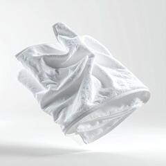 A fluffy, white folded towel floats in a soft, bright, neutral background