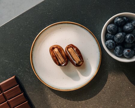 Sweet and healthy snack selection with dates and berries