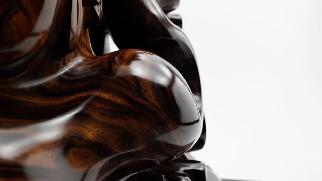 Wooden sculpture side angle with glossy surface and rich texture