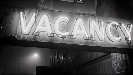 A hotel vacancy sign illuminated at night