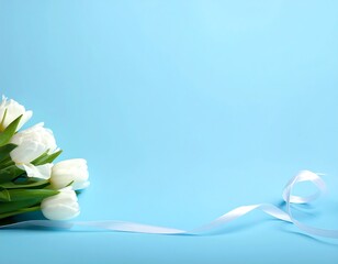 White tulips and ribbon cascade on a soft blue backdrop