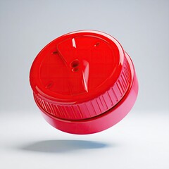 Shiny red plastic cap with textured side, angled on a white surface