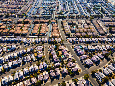 Aerial view of suburban housing grid in Los Angeles, showing dense residential blocks, straight streets, and planned urban development