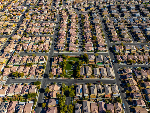 Aerial view of suburban housing grid in Los Angeles, showing dense residential blocks, straight streets, and planned urban development