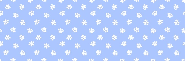Seamless pattern of white heart-shaped cat or dog paw prints on a soft blue background. Cute animal footprint wallpaper for pet-themed designs, nursery decor, and textile fabrics.