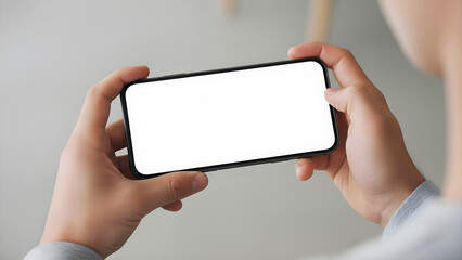 Hand holding mobile phone mockup with blank white screen in landscape view over shoulder for app design presentation digital marketing advertising social media display technology device
