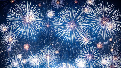 Vibrant fireworks exploding in night sky with bright white and gold sparks