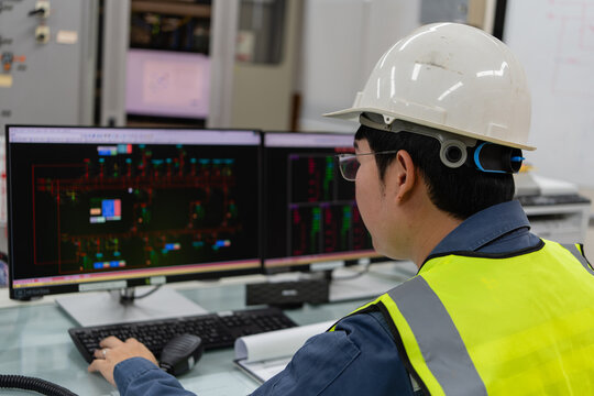 Electrical engineer monitoring digital control system on computer screens inside power facility, analyzing network data to maintain stability, operational reliability, and continuous electricity  - Powered by Adobe