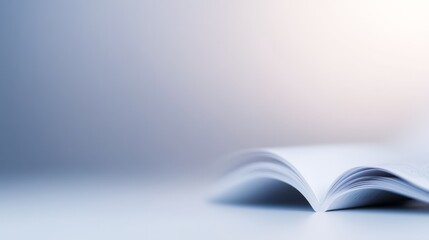 Intimate glimpse of open book displayed on elegant wooden table inviting readers to explore its pages and wisdom.