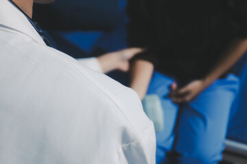 Unrecognizable uses blue hand weight during physical therapy session