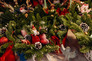 Natural spruce branches decorated with cones, Santa Claus and Christmas decor, New Year magic composition