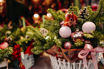 Natural spruce branches decorated with cones, Christmas balls, cinnamon, New Year magic composition