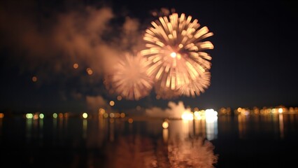 A vibrant fireworks display lights up the night sky over a serene body of water