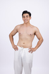 Shirtless muscular man with hands on his waist