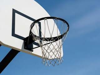 Naklejka premium Outdoor basketball hoop with net under clear blue sky
