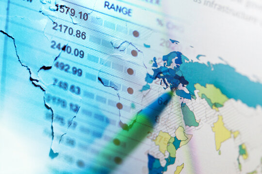 Financial data on a monitor and world map. Finance data concept. - Powered by Adobe