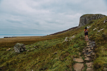 A stunning coastal landscape photograph featuring the rugged beauty of An Corran Beach and Staffin...
