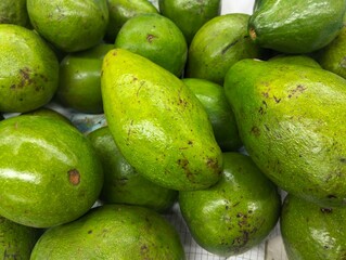 Piles of avocados in the supermarket 