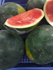 Fresh Watermelon with Red Flesh Displayed at Market