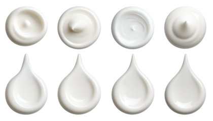 Close-up of eight swirls of creamy white substance with a black background