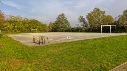 Football Field and Basketball Hoop Court With Natural Green Hedge in City Park Croatia