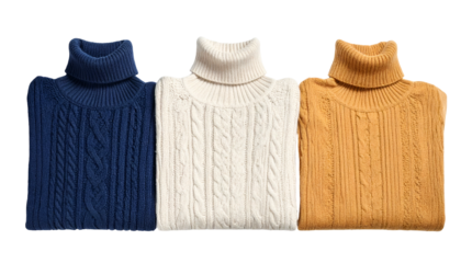 Three folded, cable-knit turtleneck sweaters in navy, cream, and mustard