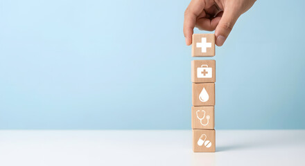 healthcare blocks stacked vertically with hand placing final piece