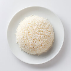 Steamed white rice served clean white plate, simple and fresh meal