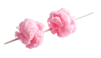 Two fluffy, pink treats on a wooden stick against a stark black background