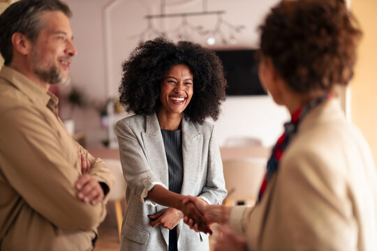 Friendly Handshake Between Colleagues In A Bright Office During A Professional Meeting