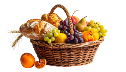 A wicker basket overflowing with bread, fruits, and grains, isolated against black