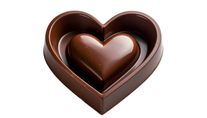 A dark chocolate heart-shaped candy with a smaller heart nestled inside, isolated on black