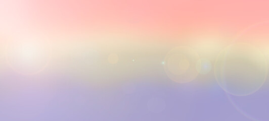 Soft gradient abstract background with lens flare effect in pastel pink, yellow, and purple hues. Dreamy bokeh light for graphic design and presentation backdrop.
