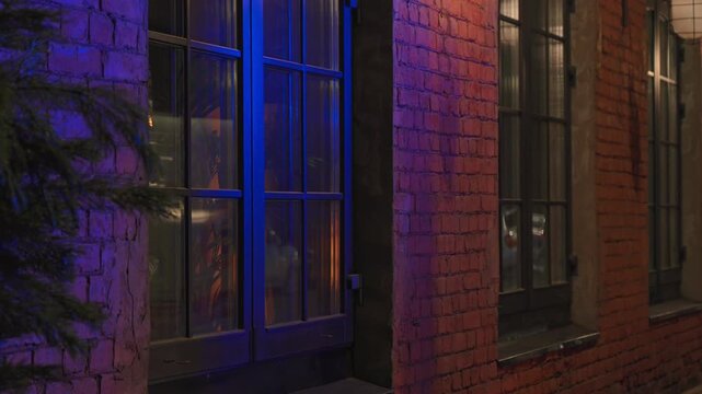 4k, A close-up view of the reflected light in the restaurant window from the warning lights of an ambulance, police car, fire truck, at nighttime