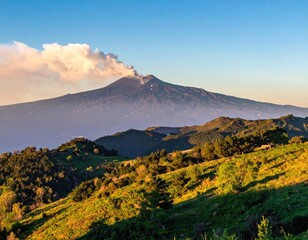 Smoking volcano over lush hills under a blue sky