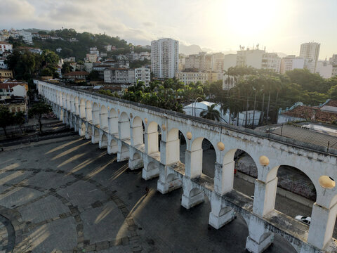 RIO DE JANEIRO, BRAZIL &ndash; NOVEMBER 2025: Aerial overhead shot of yellow tram riding on the top of Carioca Aqueduct (Arcos de Lapa), a famous landmark in old part of Rio de Janeiro, Brazil