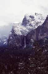 snow covered mountains waterfall in yosemite national park