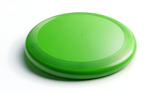 A bright green plastic disc, seen from above, rests on a white background, casting a soft shadow