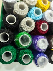 Colorful Sewing Thread Spools Collection &ndash; Textile Craft Background