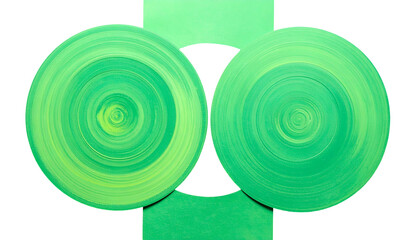 Two swirling green discs connected by a vertical green band on black background
